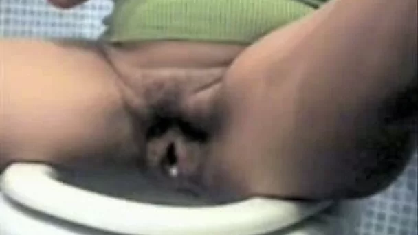Skanky wife pokes her hairy gaping pussy with double headed vibrator
