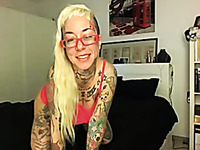 Wicked and busty tattooed blonde babe uses her pink sex toy