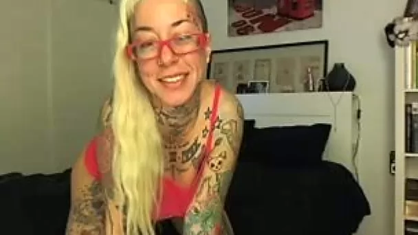 Wicked and busty tattooed blonde babe uses her pink sex toy
