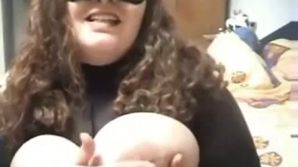 My BBW slut wearing mask is playing with her assets