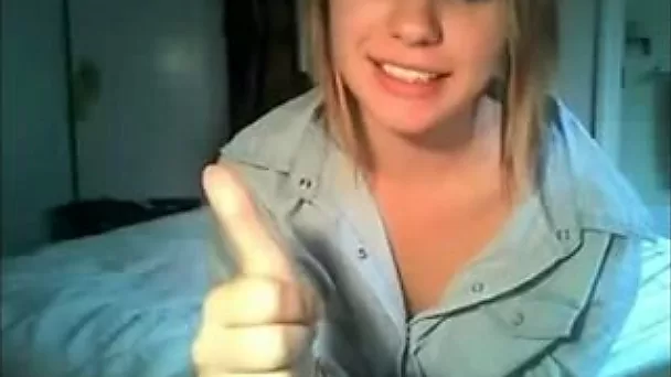 Beautiful blonde college girl in her bedroom feels nature call