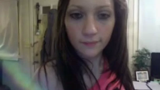 Slender pale brunette stripteases and flashes tits for me on cam