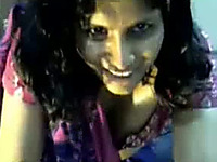 Happy genuine Indian lady in saree milks her boobs on webcam