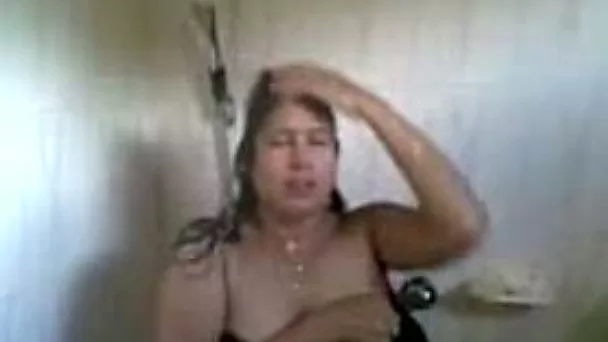 Chubby and playful amateur Indian aunty showering on cam