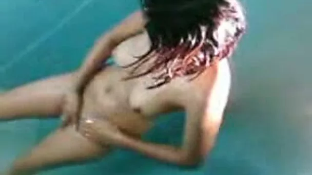 Eye catching short haired Indian black head takes a shower on camera