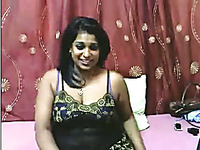 Lewd giggling amateur Indian brunette MILF flashes her big ass and tits