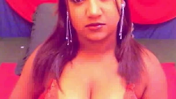 Big breasted serious looking cam girl shows off her curves and goes solo