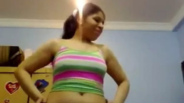 Plump amateur Pakistani brunette dances in her bright clothes on webcam