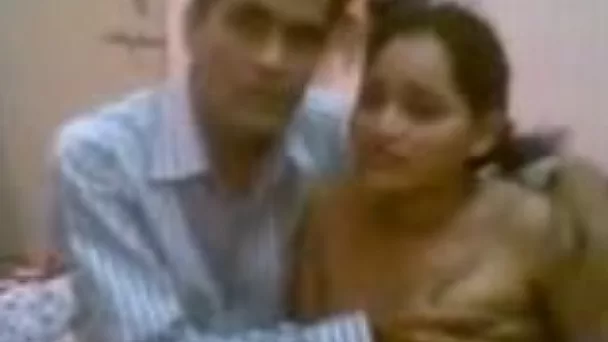 Cute and busty hot Indian wife shown on webcam topless