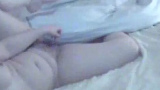 Tempting homemade video of my chubby wife masturbating in bed