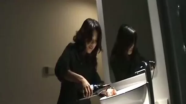 Naughty playful Chinese girl masturbating with a bottle