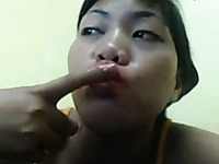 Disgusting webcam Asian bitch plays with her saliva mouth