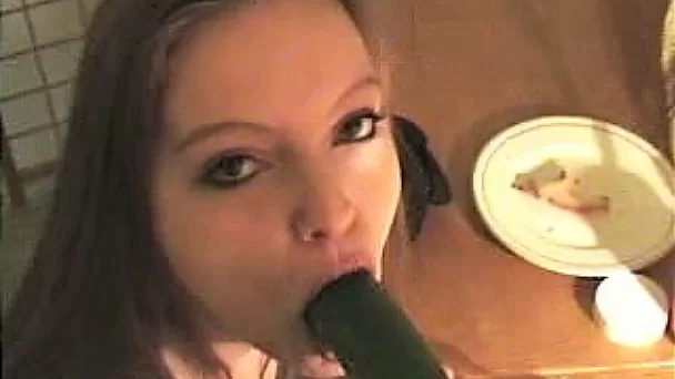 Brunette girlfriend in the kitchen fucking herself with banana