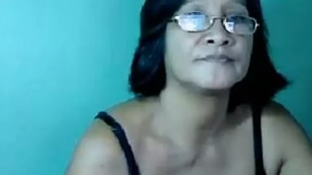 Short haired mature Asian lady in glasses stripteased for me on webcam