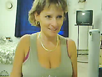 Short haired MILFie webcam nympho plays with her boobies for me