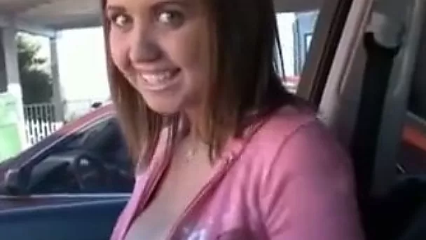Happy young babe in the car flashes her gorgeous tits