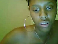 Petite ebony babe rubs her shaved tight slit on the webcam
