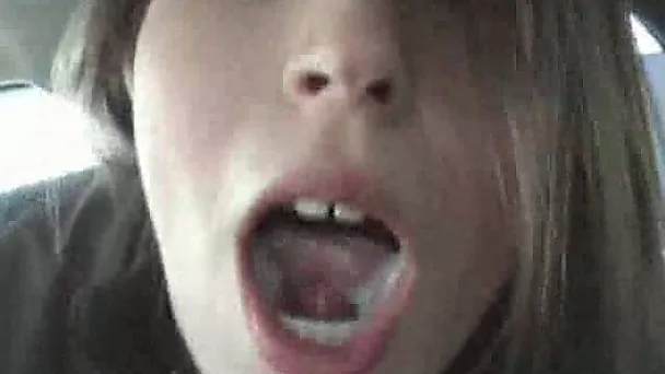 Frisky brown haired coed babe blows me and takes mouthful in car