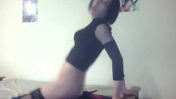 Sissy brunette shemale rides big dildo in his bedroom