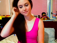Brunette teen angel takes off her pink dress on webcam