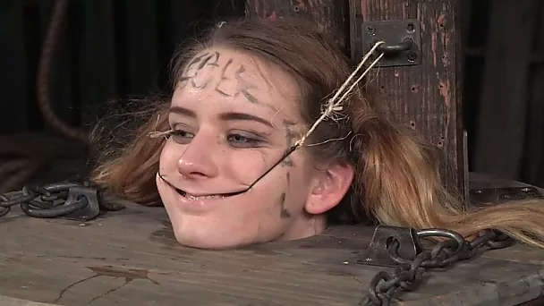 White blonde young whore put in the barrel and fed with chocolate pasta