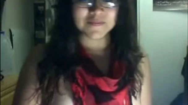 A bit plump nerdy brunette flashed her booty while teasing her own slit