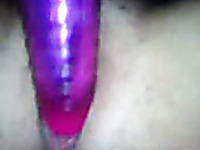 My neon purple sex toy penetrates closeup pussy
