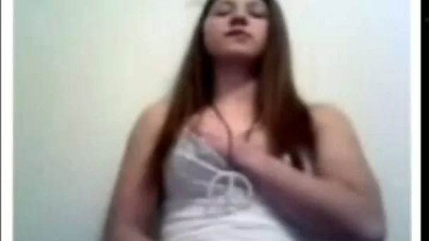 My shy girlfriend is playing with her pussy on a web camera without taking off clothes