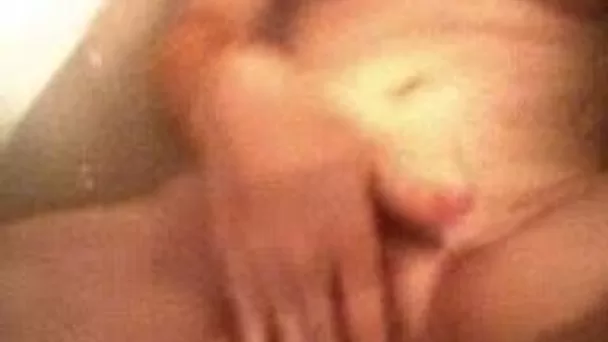 Mature horny wife fingering hairy pussy while bathing in a bath