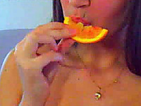 Frisky brown haired cutie rubs her goodies with orange for me