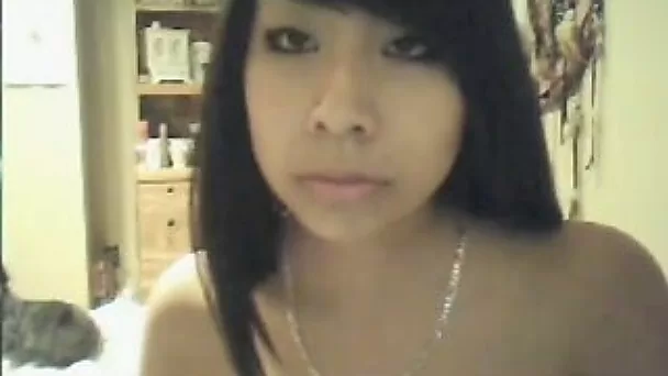 Attractive Asian babe shows me her small and perky tits on webcam