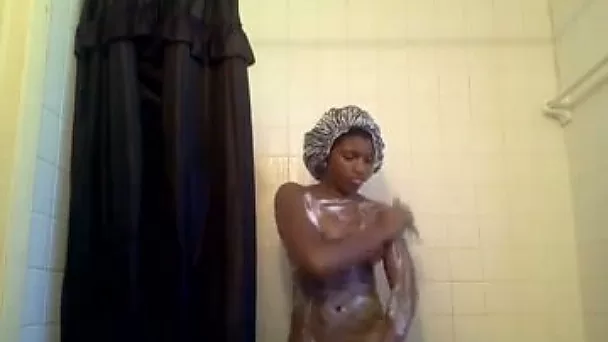 Busty ebony friend rubbing her sexy body with shower gel