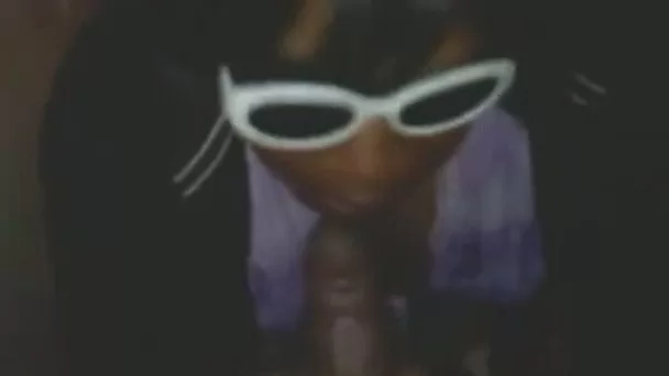 Black dumb cock gobbling whore in sunglasses its dick again