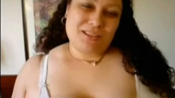 Curly chubby amateur Latina webcam nympho plays with her huge melons