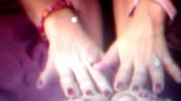 Charming brunette webcam girl sucks on her delicious feet