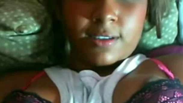 Hot dark skin cutie on her bed flashing her pussy on cam