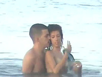 Cute brunette girl in the water with her boyfriend