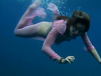 Two adorable and svelte sexy girls in the blue deep sea