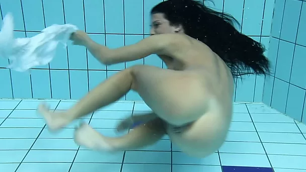 Skinny mesmerizing teen babe recorded on cam underwater