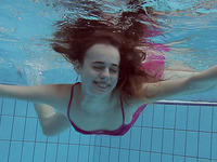 Outstadning pale skin Russian beauty dips in the pool