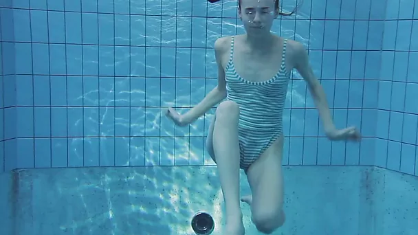 Petite white cute bitch all nude in the pool underwater