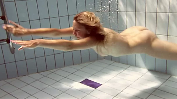 Sporty and cute Russian teen chick in the water naked