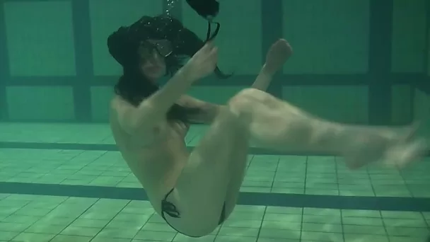 Slender pale skin babe from Russia topless in the pool