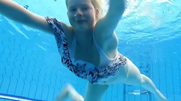 Blonde European sweetheart shows off her body underwater