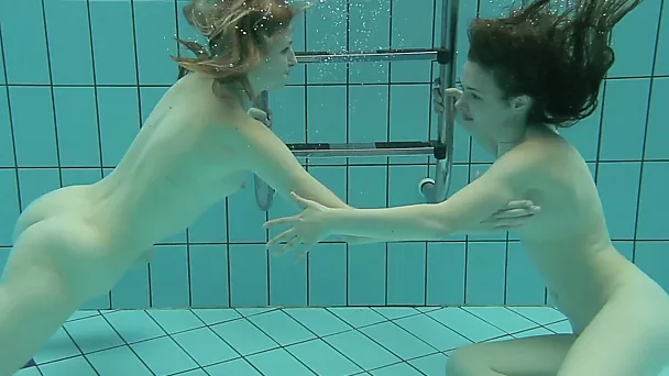Two cute white sexy college girls from Russia under water