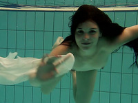 Lascivious brunette European babe loosens her buttons under water