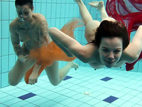 Cute brunette teen babes enjoying cool water in the pool