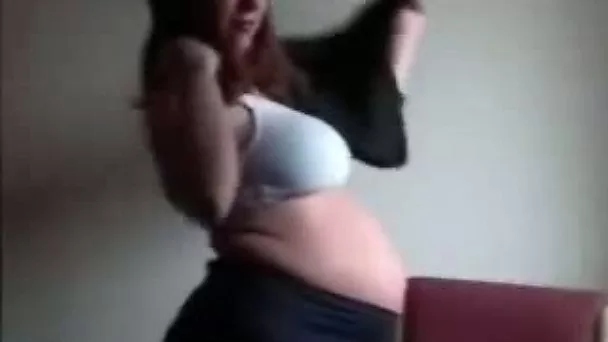 My sexy pregnant wife posing on camera in underwear