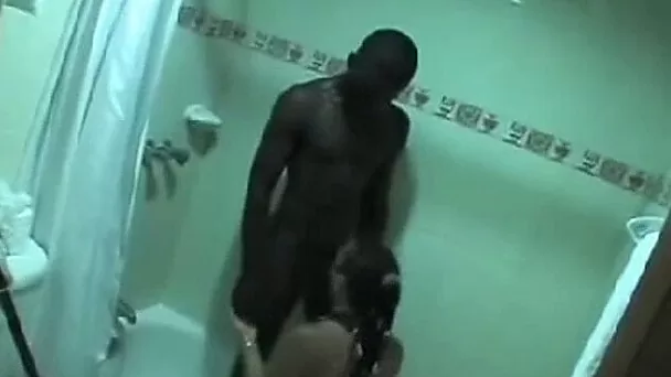 Black young man pleases brunette white lady in hotel room
