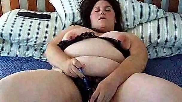 Horny mature BBW wife Nicole pleases her cunt with dildo in bed